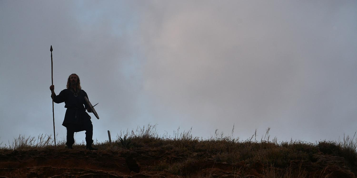 Silhouette on a ridge with spear and shield